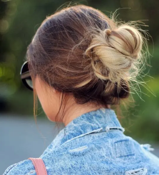 side braided bun with blonde balayage hair