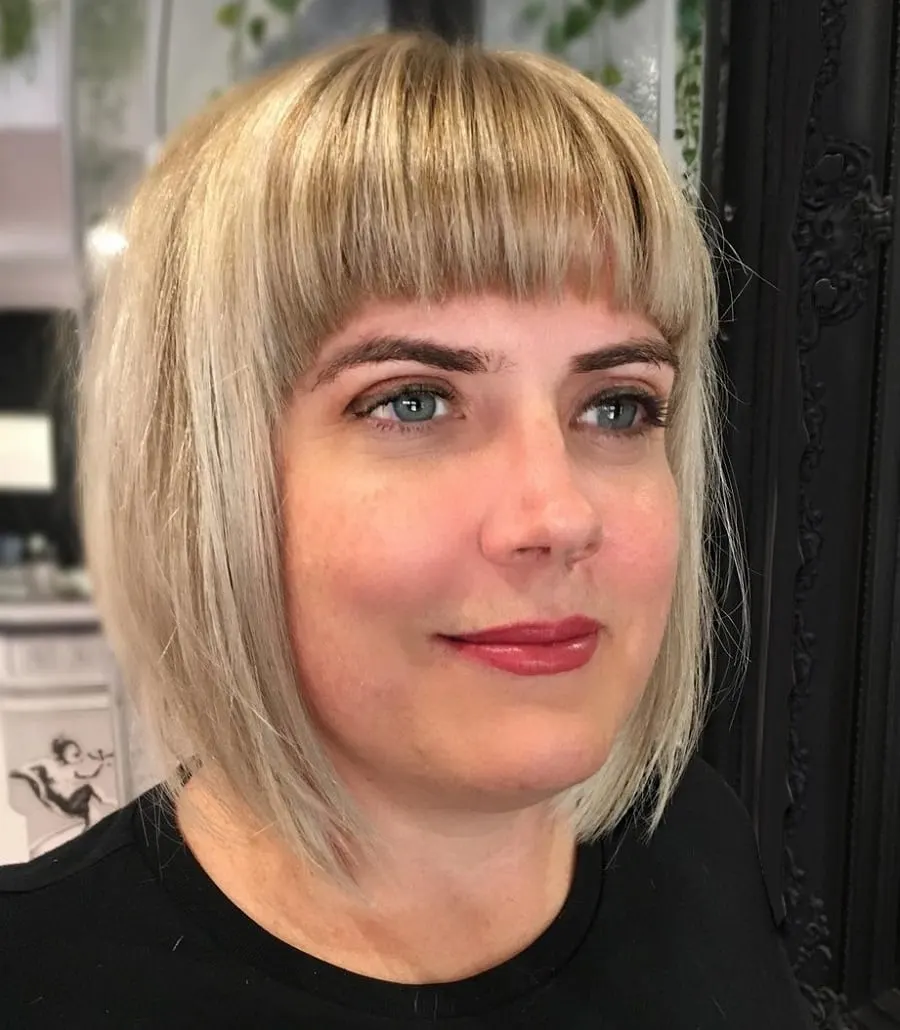 blonde balayage bob with bangs