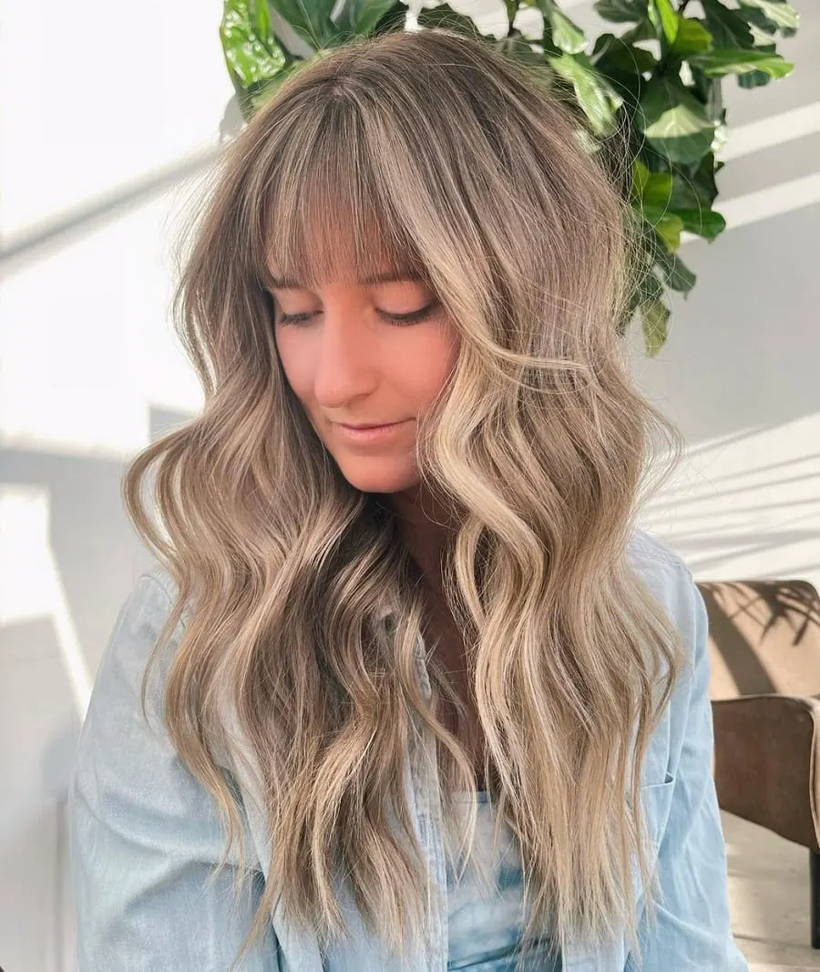 blonde balayage hairstyle with bangs