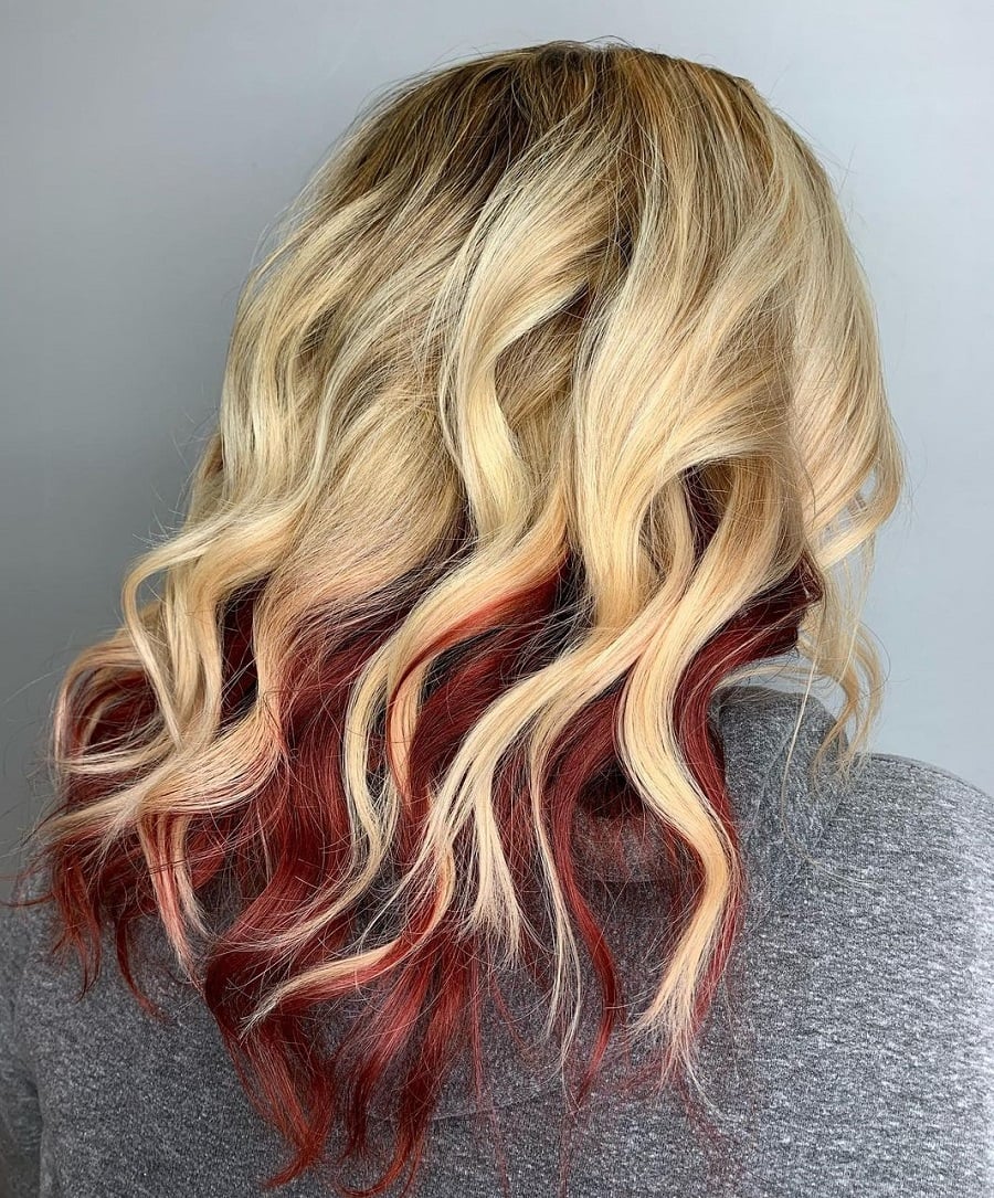 blonde curls with dark red underneath