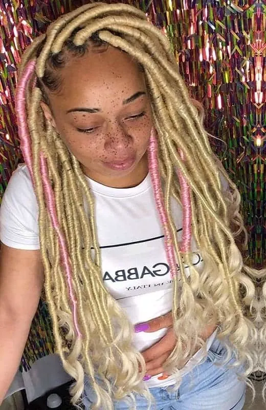 blonde faux locs with pink highlights 