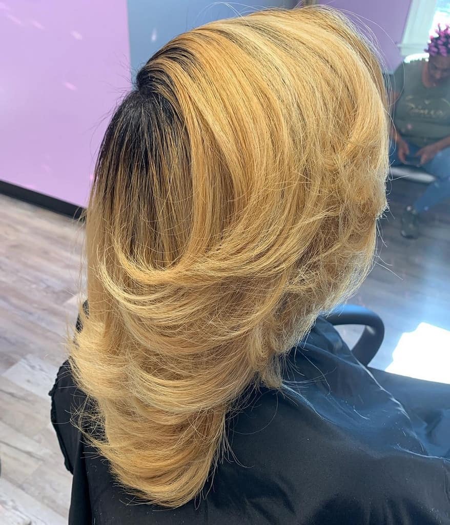 blonde feathered hair with dark roots