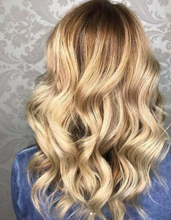dark brown roots with golden blonde hair