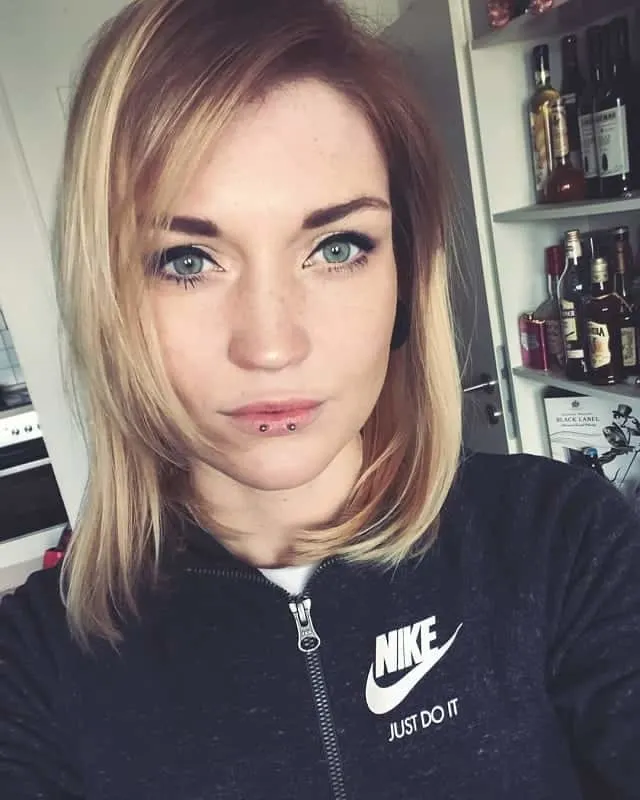 long blonde bob with green eyes