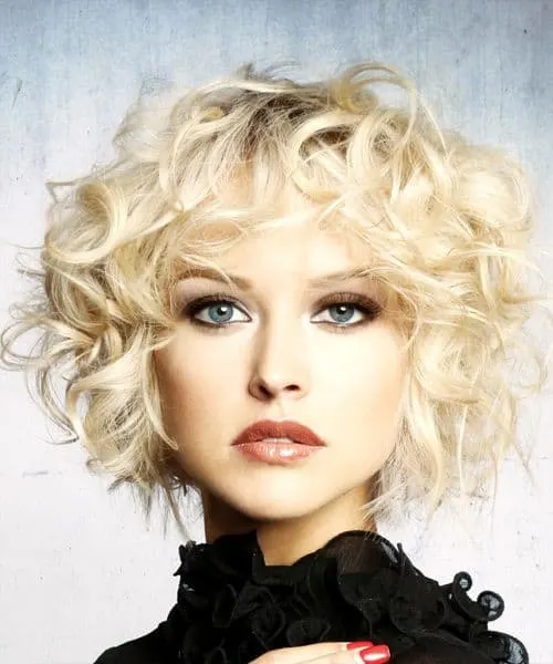 curly blonde hair with bangs