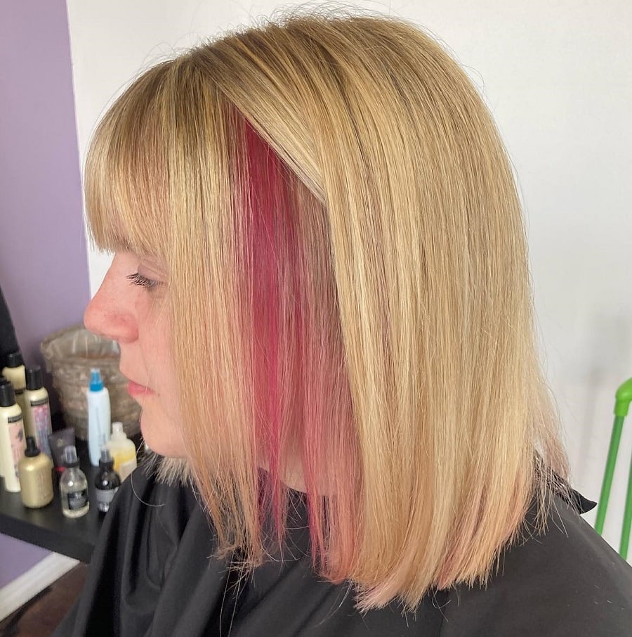 blonde hair with bangs and pink underneath