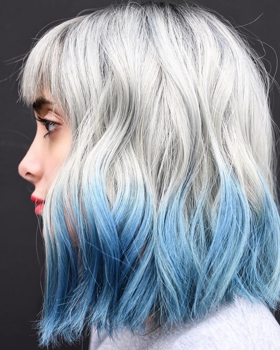 Blonde hair with blue ends and bangs