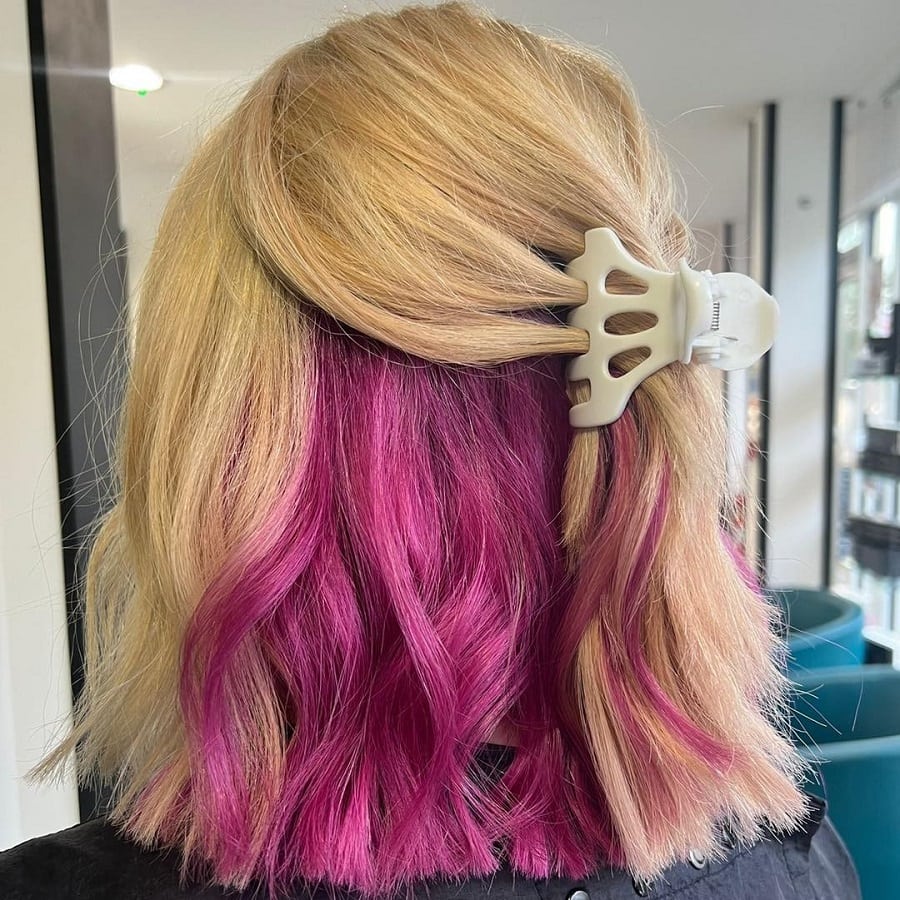 Blonde hair with fuchsia pink underneath