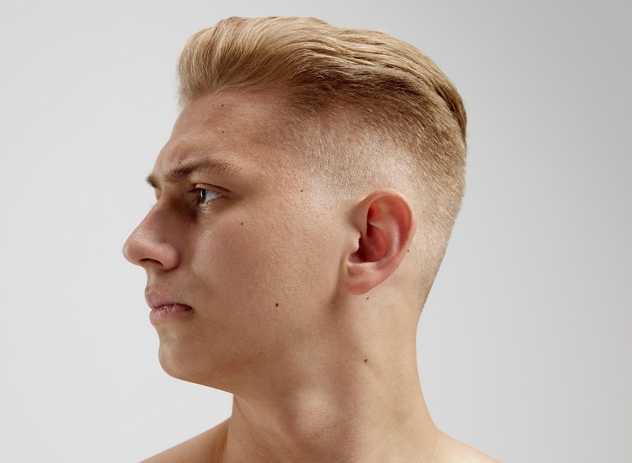 Blonde hair with a medium fade for a round face