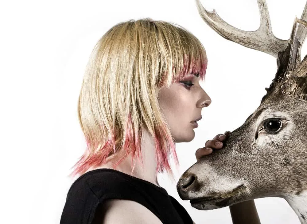 blonde hair with pink highlighted bangs
