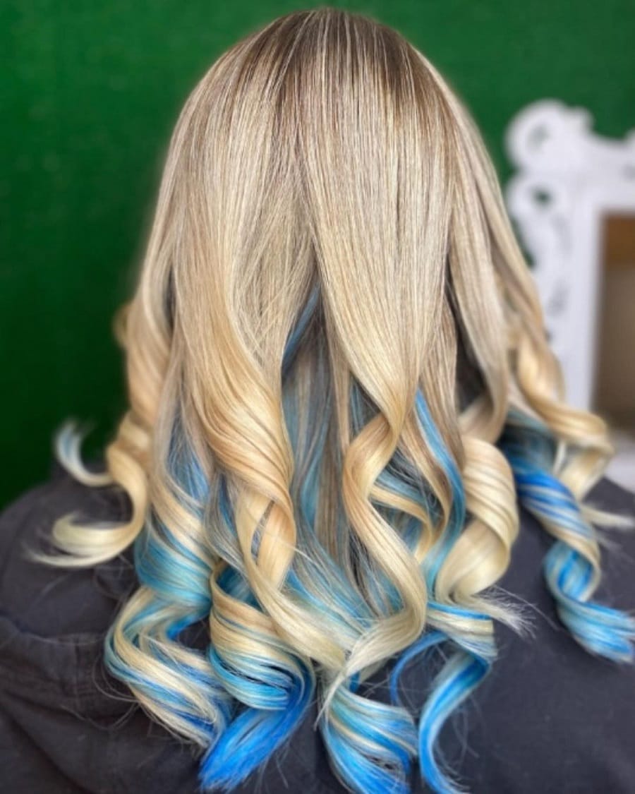 Loose blonde curls with blue tips