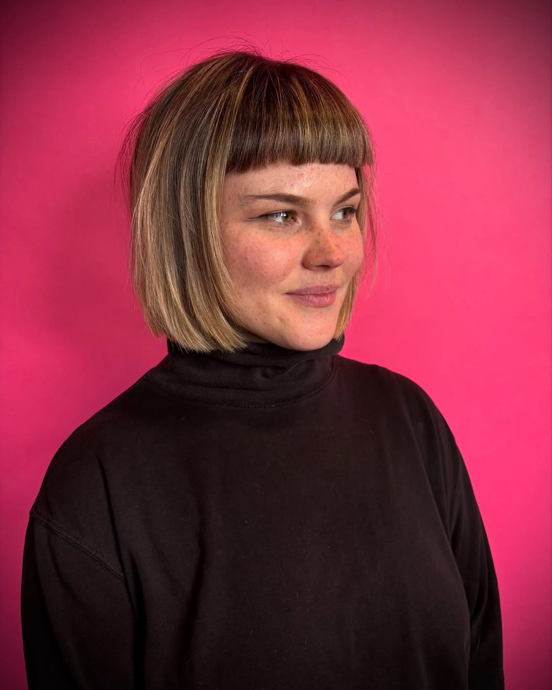 Straight Dutch boy haircut for women with blunt baby bangs