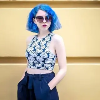 woman with blue curly hair