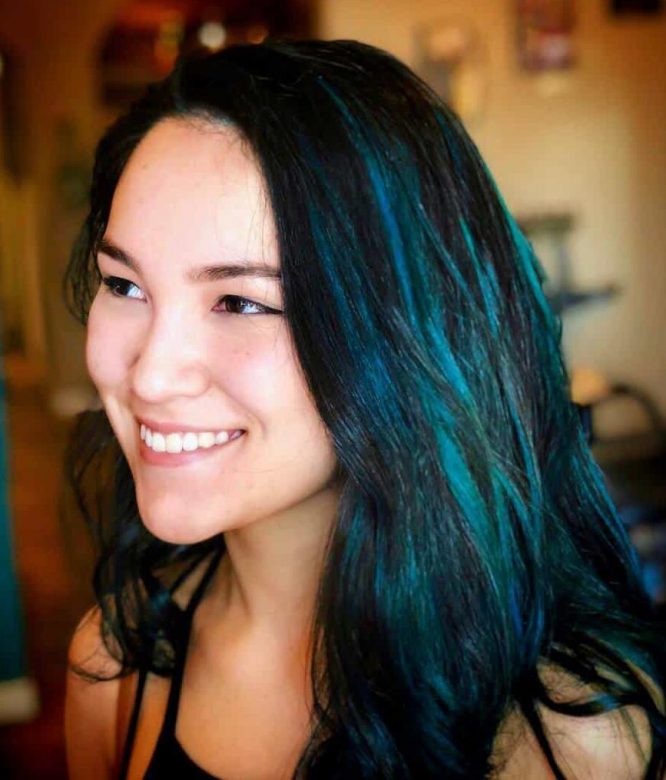black hair with teal blue highlights