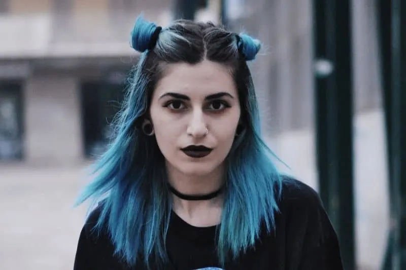 blue space buns with shadow root hair