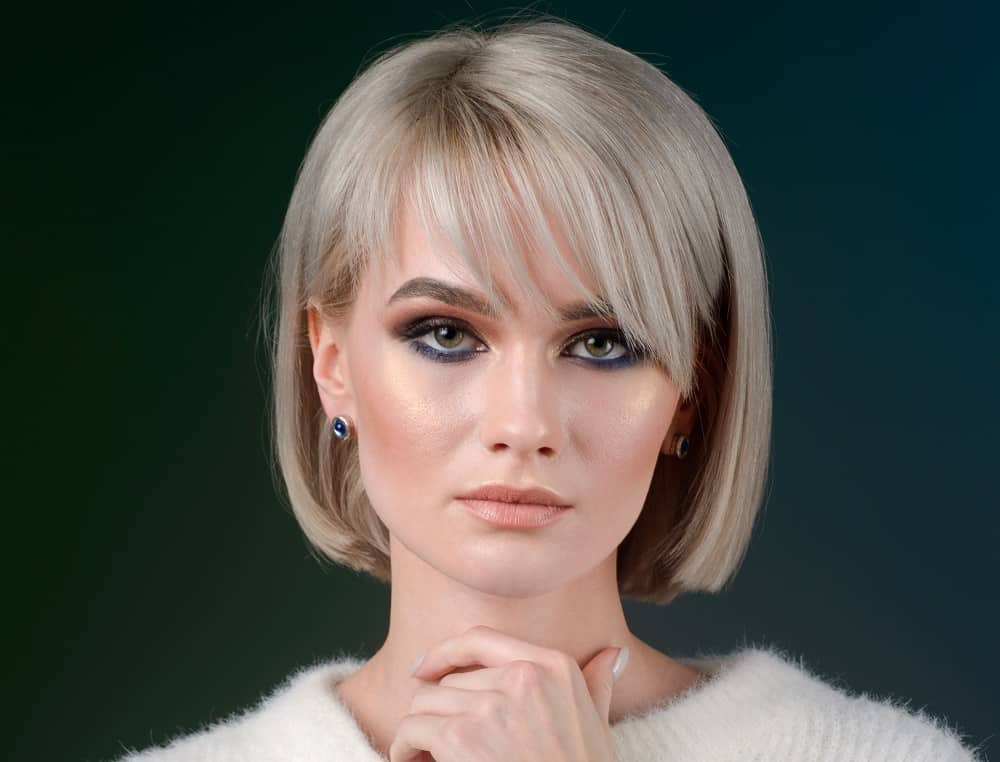 Image of Chin-length blunt bob with side swept bangs