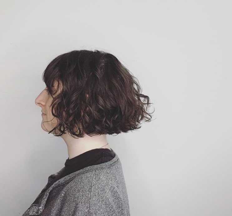blunt bob with curly bangs