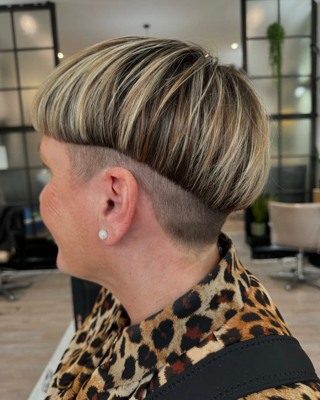 Modern bowl cut with dimensional blonde highlights