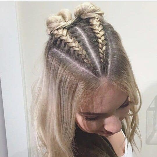 boxer braid hairstyle with top bun