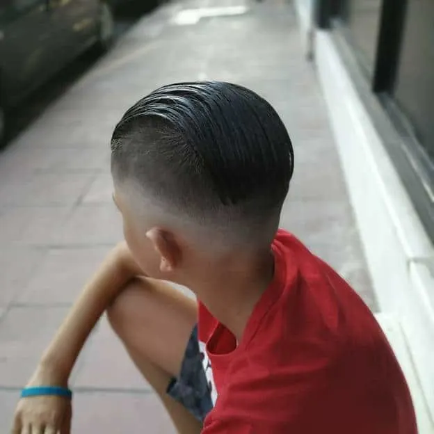 boy's slick back long hair with short sides
