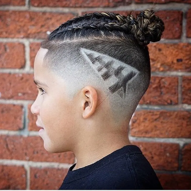 boys braided topknot with paper plane design