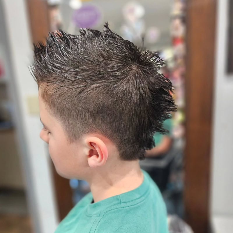Edgy long faux hawk with short sides for boys