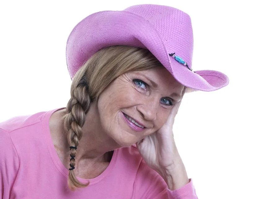 braid hairstyle with hat for women over 50