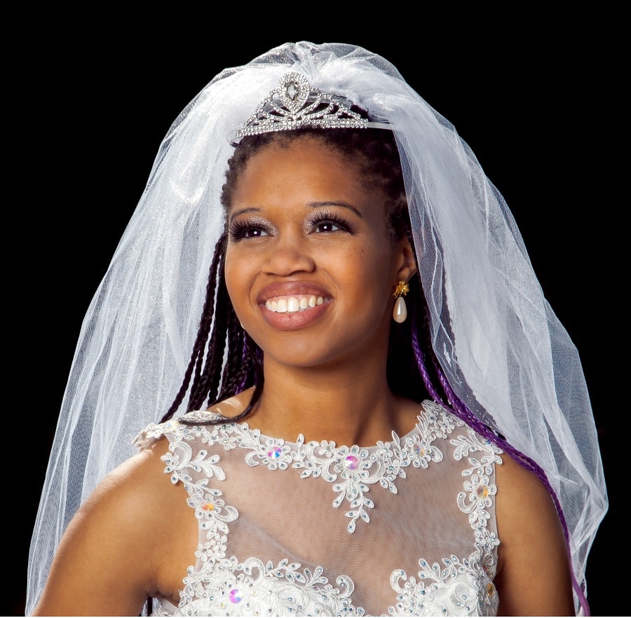 braided hairstyle with tiara and veil for brides