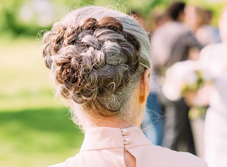 braided updo for wedding guest over 50