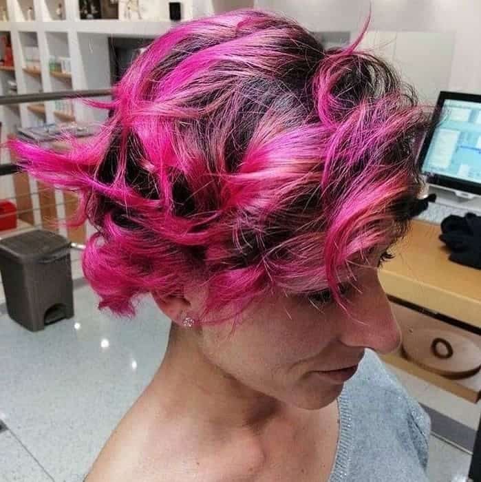 hot pink highlights in short choppy brown hair