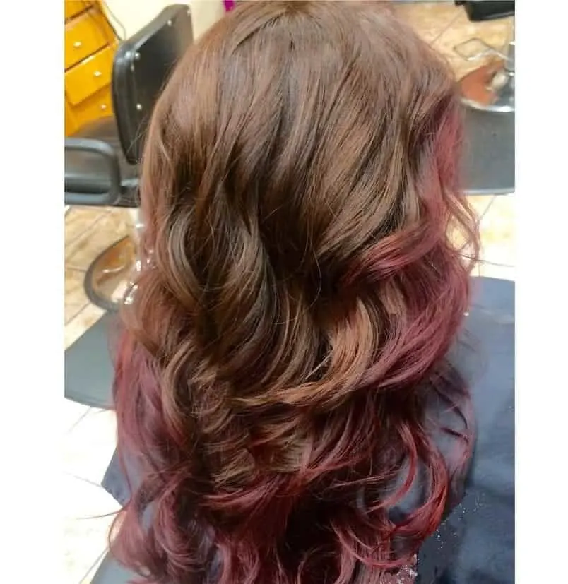curly brown hair with red underneath