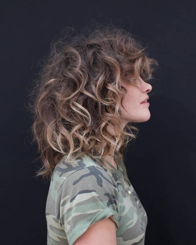 brown curly hair with blonde highlights 
