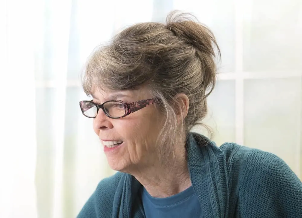 bun with glasses for over 50 women