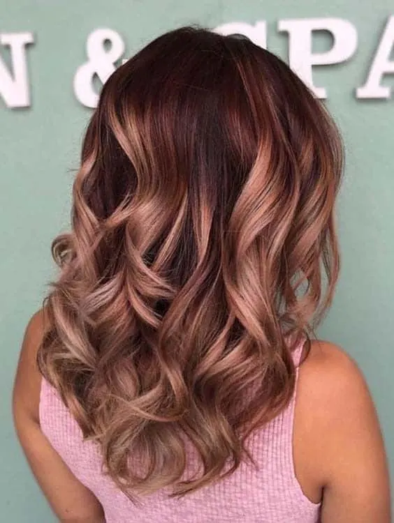 blonde highlights on wavy burgundy hair