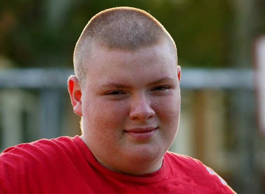 Buzz cut for a young guy with a round face