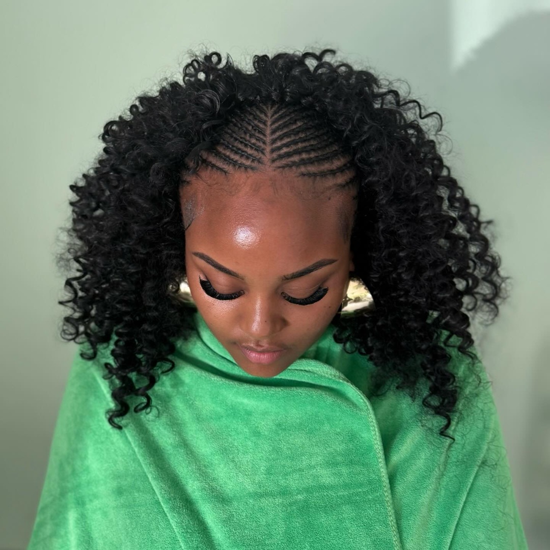 Center-parted stitch sew in braids with voluminous tight curls