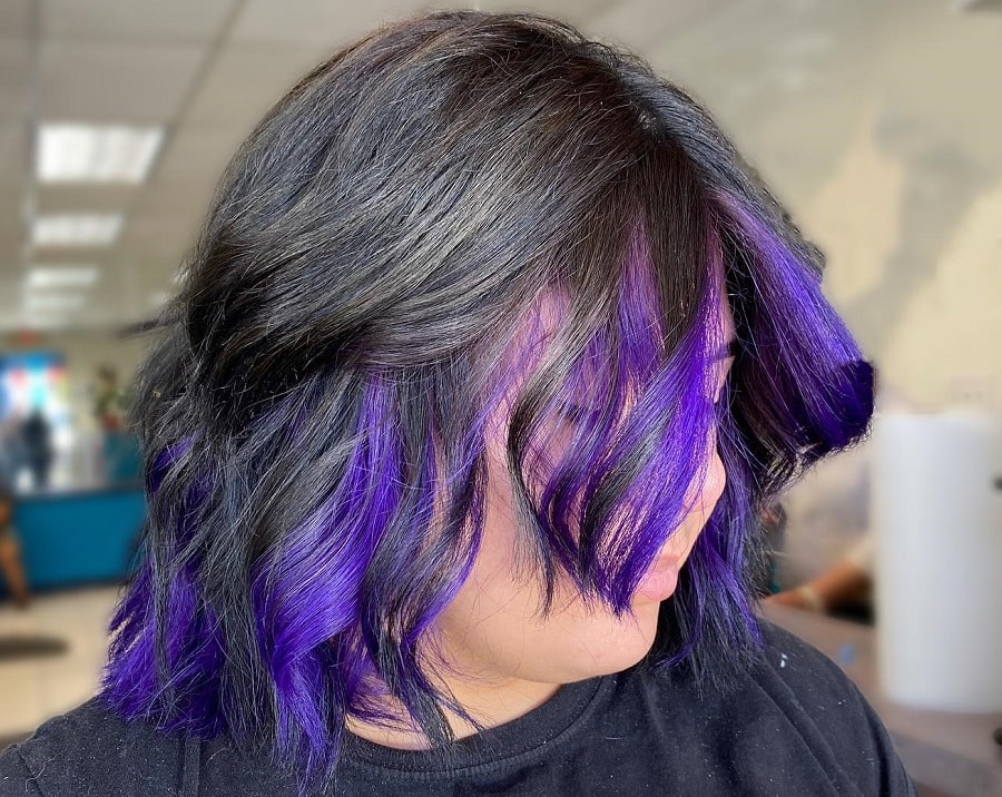 Black hair cut with purple underneath