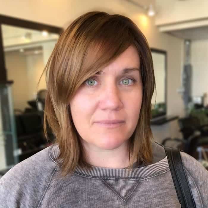 choppy layers with long side bangs