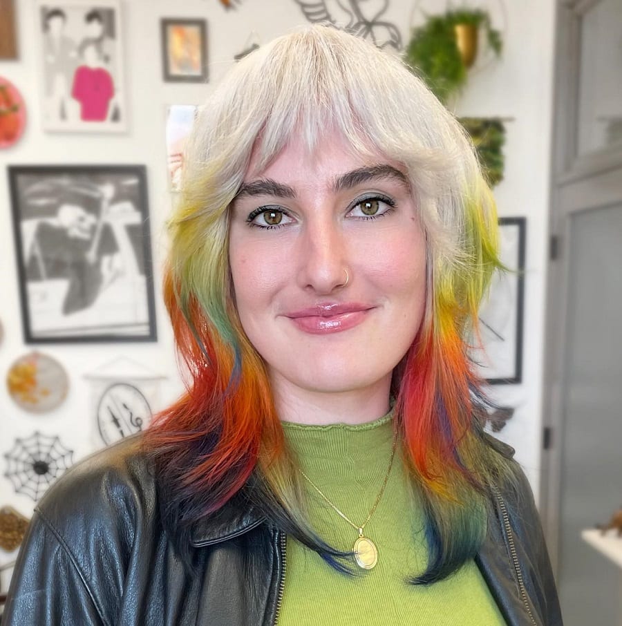 Colorful layered hair with curtain bangs