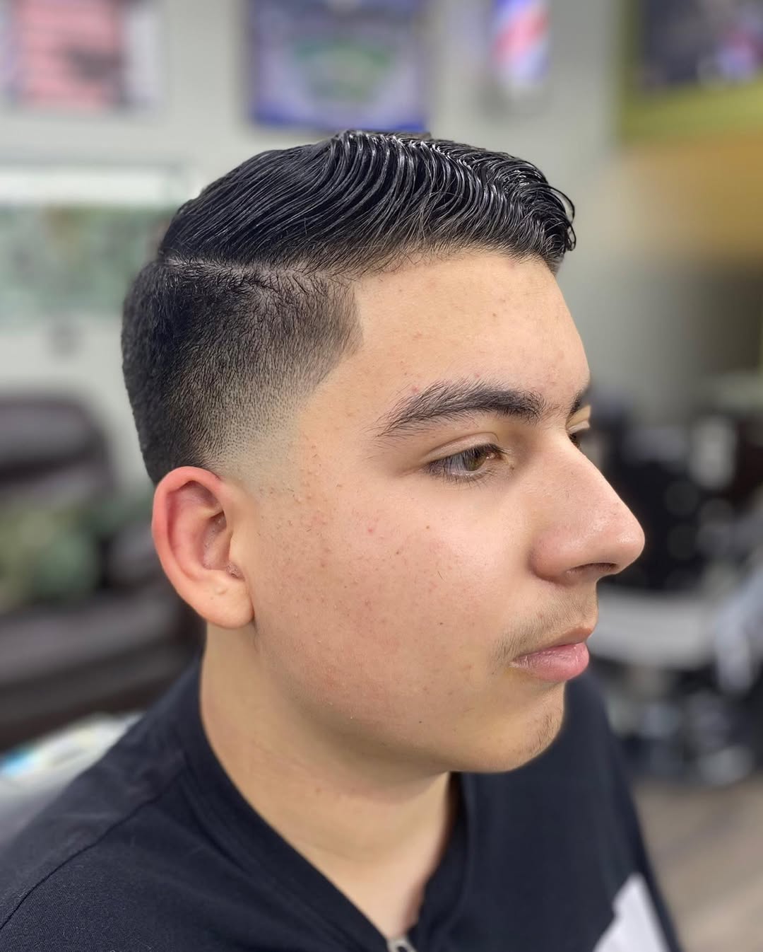 sleek comb over fade haircut for round face men