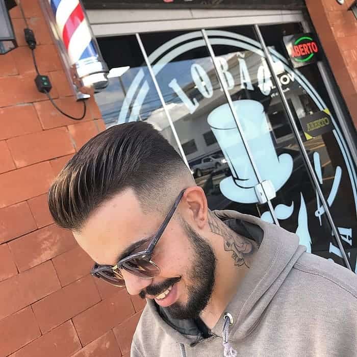 comb over hairstyle with mid fade