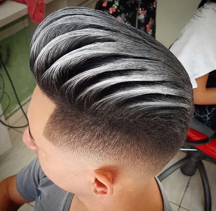 comb over haircut with silver highlights