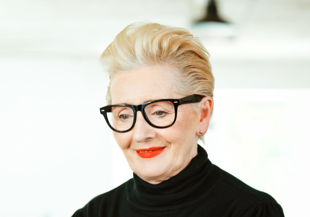 Comb-over pixie cut for older women with glasses