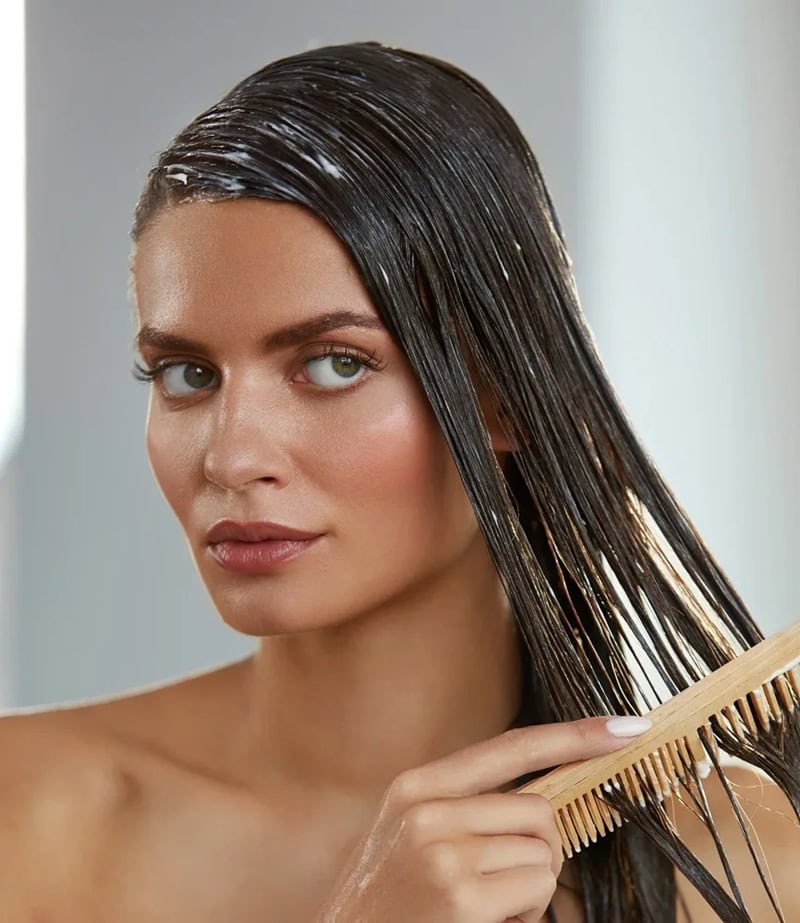 combing product through wet hair, highlighting common mistakes while co-washing