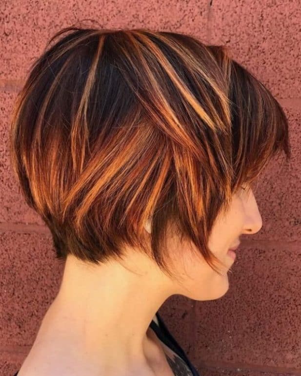 Dark copper brown hair with highlights