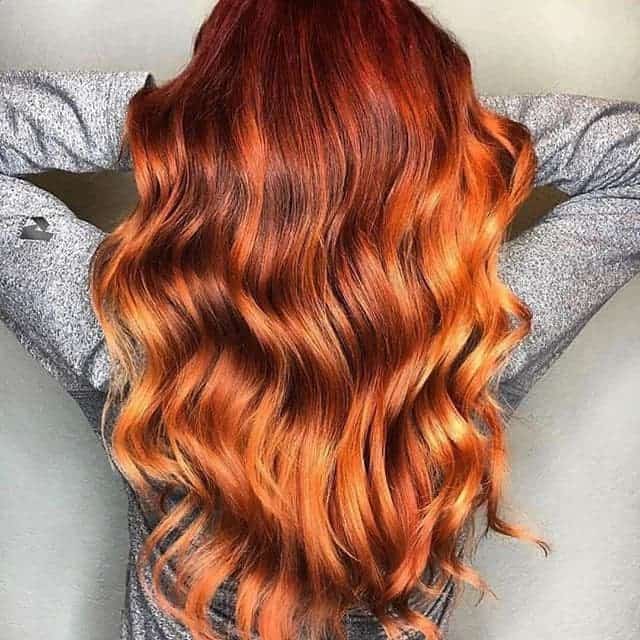 girl with wavy copper ombre hair