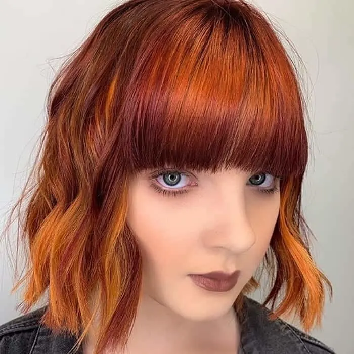 copper red bob with bangs