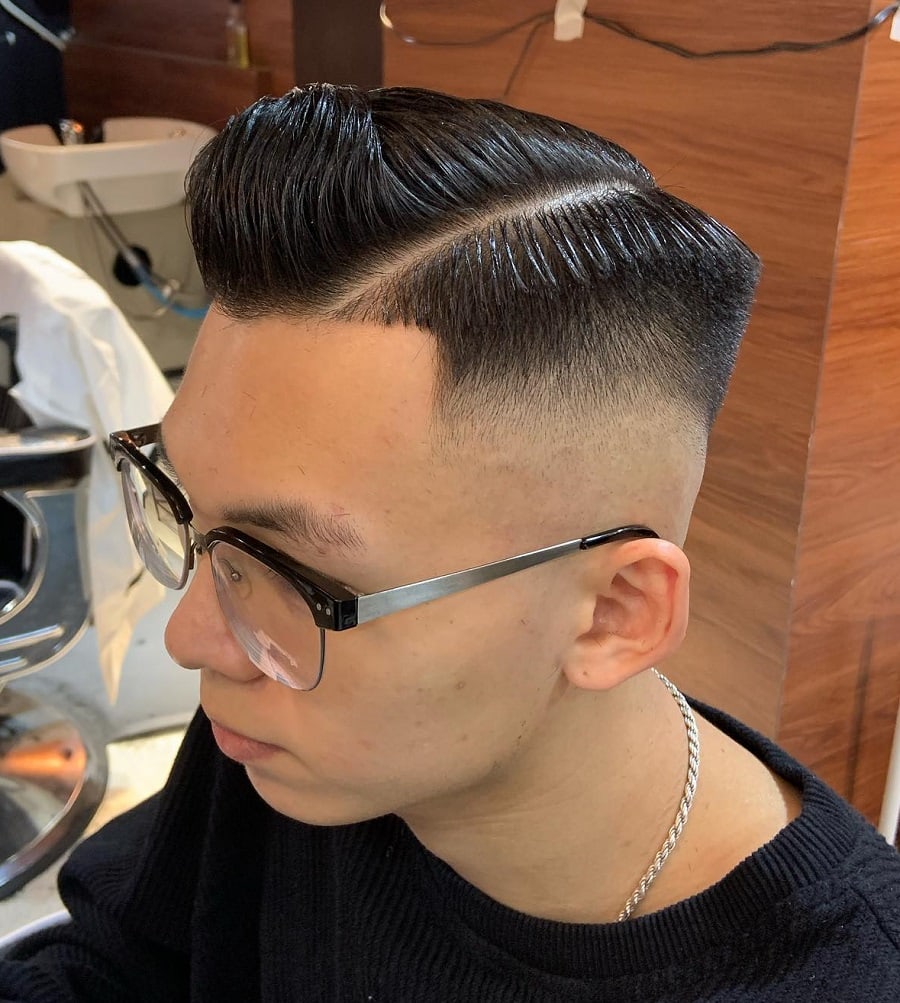 crew cut with hard part and glasses