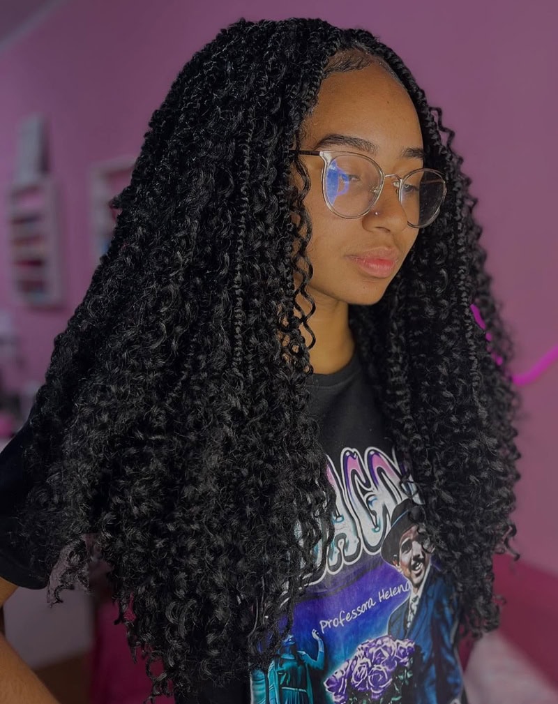 long black curly crochet braids with a middle part, a protective style for alopecia coverage