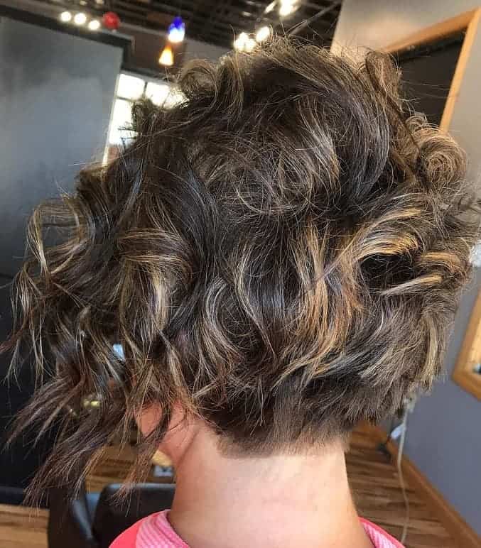 curly asymmetrical bob with highlights